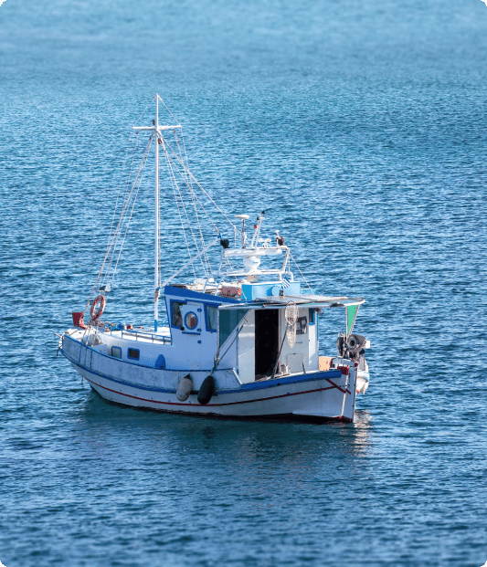 Small boat anchored in ocean